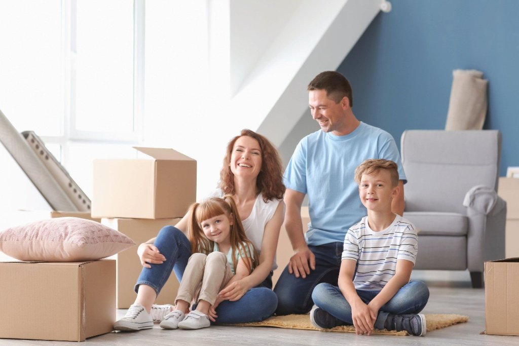 Happy family in their new home after moving with D & L Movers